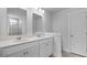 Bathroom with double vanity, quartz countertop, and tiled shower at 127 Lilac Grove Way, Summerville, SC 29486
