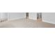 Carpeted bedroom with white trim, doors ajar showcasing the hallway at 127 Lilac Grove Way, Summerville, SC 29486