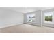 Bright bedroom features two windows and neutral carpeting at 127 Lilac Grove Way, Summerville, SC 29486