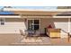Outdoor dining on a wood deck with awning and grill in the backyard at 1288 Old Colony Rd, Mount Pleasant, SC 29464