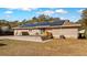 Backyard view of a house with solar panels and outdoor seating on a deck at 1288 Old Colony Rd, Mount Pleasant, SC 29464