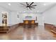 Finished basement featuring a bar area with two orange barstools and a fan above at 1288 Old Colony Rd, Mount Pleasant, SC 29464