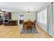 Inviting dining area featuring hardwood floors, modern lighting, and neutral paint at 1288 Old Colony Rd, Mount Pleasant, SC 29464