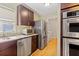 Bright kitchen featuring modern stainless steel appliances and ample counter space at 1288 Old Colony Rd, Mount Pleasant, SC 29464