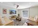 Bright living room featuring hardwood floors, modern furnishings, and sliding doors to the backyard at 1288 Old Colony Rd, Mount Pleasant, SC 29464
