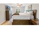 Comfortable main bedroom with hardwood floors, ceiling fan, and natural light from the window at 1288 Old Colony Rd, Mount Pleasant, SC 29464