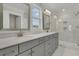 Bathroom featuring double vanity, grey cabinetry, quartz countertops, marble floors, mirrors and a glass shower at 132 Grange Cir, Summerville, SC 29486