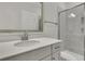 Well lit modern bathroom featuring a sleek quartz vanity and a glass-enclosed shower at 132 Grange Cir, Summerville, SC 29486