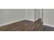 Bedroom with attractive dark wood-look flooring and modern white trim and a glimpse of closet at 132 Grange Cir, Summerville, SC 29486