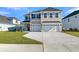 Charming two-story home with attached two-car garage and well-manicured front lawn at 132 Grange Cir, Summerville, SC 29486