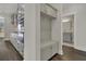 Hallway with a built-in storage bench and open access to kitchen and bathroom at 132 Grange Cir, Summerville, SC 29486