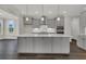 Gourmet kitchen featuring a large center island, stylish cabinetry, and stainless steel appliances at 132 Grange Cir, Summerville, SC 29486