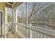 Relaxing screened balcony view of the neighborhood pond and landscape at 1321 Telfair Way, Charleston, SC 29412