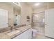 Bright bathroom featuring a vanity with granite countertop, shower, and toilet at 1321 Telfair Way, Charleston, SC 29412