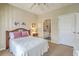 Cozy bedroom with a comfortable bed, bedside table, and view to an ensuite bathroom at 1321 Telfair Way, Charleston, SC 29412