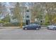 Multi-story condominium building with well-maintained landscaping and ample parking at 1321 Telfair Way, Charleston, SC 29412