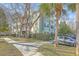 Low-rise condo exterior with lots of vegetation around the property at 1321 Telfair Way, Charleston, SC 29412
