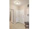 Bright tiled foyer area with three doors and a convenient bench at 1321 Telfair Way, Charleston, SC 29412
