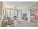 Cozy living room with modern furnishings and view to the main bedroom at 1321 Telfair Way, Charleston, SC 29412