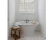 Serene bathroom with a freestanding tub, neutral colors, marble floors, and a window with plantation shutters at 1328 Upper Union Rd, Mount Pleasant, SC 29464