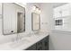 Modern bathroom featuring double vanity with sleek mirrors and bright natural light from the window at 1328 Upper Union Rd, Mount Pleasant, SC 29464