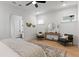 Spacious bedroom with sitting area, decorative wall hangings, hardwood floors, and plenty of natural light at 1328 Upper Union Rd, Mount Pleasant, SC 29464