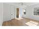 Unfurnished bedroom featuring hardwood floors, bright windows, and access to an ensuite bathroom at 1328 Upper Union Rd, Mount Pleasant, SC 29464
