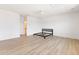 Spacious bedroom with wood-look flooring, white walls, ceiling fan and en-suite bathroom at 1328 Upper Union Rd, Mount Pleasant, SC 29464