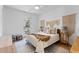 Cozy bedroom with white walls, stylish macrame wall decor, and a door to a private balcony at 1328 Upper Union Rd, Mount Pleasant, SC 29464