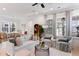 Inviting living room boasts neutral tones, layered textures, elegant curtains, and comfortable seating arrangement at 1328 Upper Union Rd, Mount Pleasant, SC 29464
