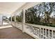Inviting outdoor porch features white railings and views of the beautiful surrounding nature at 1328 Upper Union Rd, Mount Pleasant, SC 29464