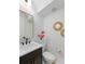 Chic powder room with a modern vanity, gold-framed mirror, decorative accents, and stylish fixtures at 1328 Upper Union Rd, Mount Pleasant, SC 29464