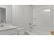 Bright bathroom with granite countertops, new fixtures, and a shower-tub combination at 134 Lilac Grove Way, Summerville, SC 29486