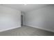A bright bedroom with neutral carpet and fresh paint awaits your personal touch at 134 Lilac Grove Way, Summerville, SC 29486