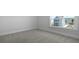 Bedroom with natural light, fresh paint, new carpet, and a view of the neighbor's house at 134 Lilac Grove Way, Summerville, SC 29486