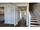 View of the home's entryway with hardwood floors and staircase leading to the second floor at 134 Lilac Grove Way, Summerville, SC 29486