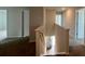 Hallway with carpet leads to downstairs; shows open floorplan of the house at 134 Lilac Grove Way, Summerville, SC 29486