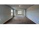 Bright living room filled with natural light through the large windows at 134 Lilac Grove Way, Summerville, SC 29486