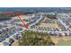 Aerial view of a residential neighborhood showcasing the layout, lakes, and proximity to amenities at 143 Oyster Tide Ave at 143 Oyster Tide Ave, Summerville, SC 29485