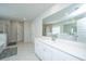 Elegant bathroom with marble floors, dual sinks, large mirror, and a luxurious shower at 143 Oyster Tide Ave, Summerville, SC 29485