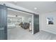 Bedroom featuring a sliding barn door leading to a sitting area with an abundance of natural light at 143 Oyster Tide Ave, Summerville, SC 29485