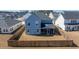 The exterior backyard features a well-maintained fence and a screened-in porch, enhancing the property's privacy and appeal at 143 Oyster Tide Ave, Summerville, SC 29485