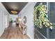 Elegant foyer with wood floors, decorative lighting, and a stylish console table at 143 Oyster Tide Ave, Summerville, SC 29485