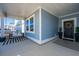 Charming front porch with a cozy swing and blue siding creates a welcoming entrance to this home at 143 Oyster Tide Ave, Summerville, SC 29485