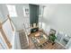 Open-concept living area with a statement fireplace, comfortable seating, and abundant natural light at 143 Oyster Tide Ave, Summerville, SC 29485