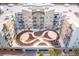 Upscale condo building featuring a courtyard with beautifully landscaped green space and unique garden design at 145 Pier View St # 316, Charleston, SC 29492