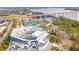 Aerial view of a tennis complex with multiple courts, grandstand seating, and lush greenery at 145 Pier View St # 316, Charleston, SC 29492