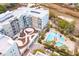 Aerial view of modern apartment complex with a swimming pool, landscaping, and outdoor amenities at 145 Pier View St # 316, Charleston, SC 29492