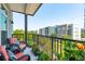 Relaxing balcony view with comfortable seating and colorful flower boxes overlooking the building at 145 Pier View St # 316, Charleston, SC 29492