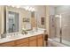 Spacious bathroom with a double vanity, glass-enclosed shower, and elegant fixtures for a luxurious feel at 145 Pier View St # 316, Charleston, SC 29492